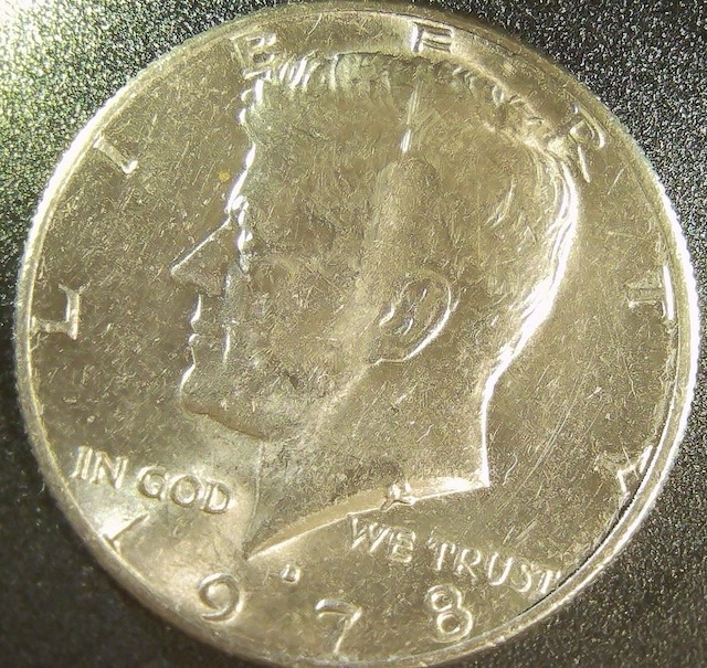 1978 Kennedy half dollar die crack error showing raised line through obverse field