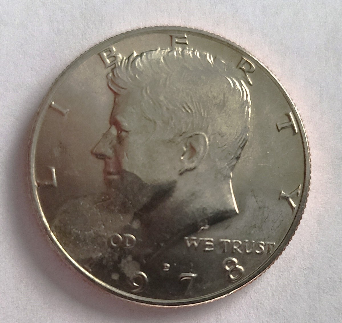 1978 Kennedy half dollar weak strike error showing softly defined hair details on Kennedy portrait and flat eagle feathers on reverse